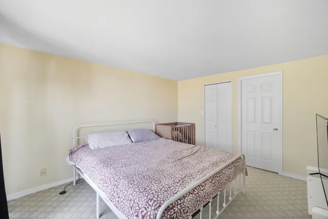 a bedroom with a bed and a cabinets