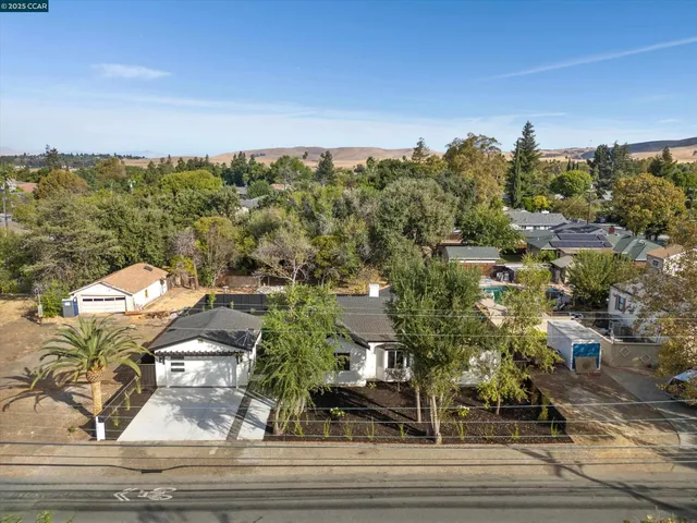 a picture of a bathroom with a picture of a open white and white and white