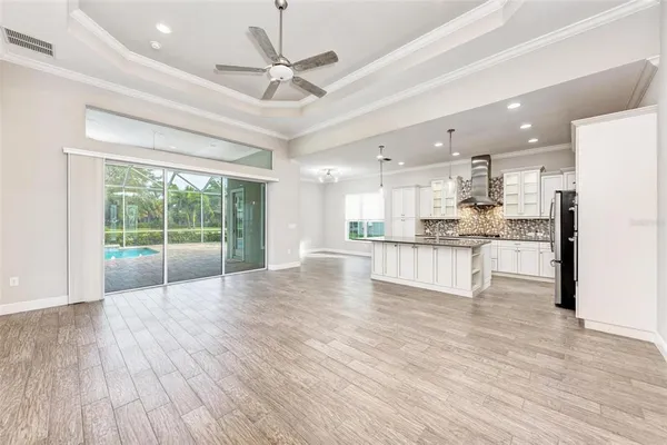 a view of kitchen and kitchen with granite countertop