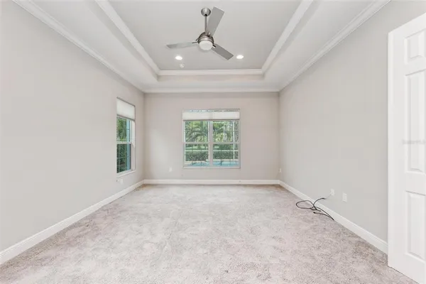 a view of a hallway with a livingroom and a bathroom with sink