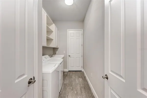 a view of a backyard with swimming pool