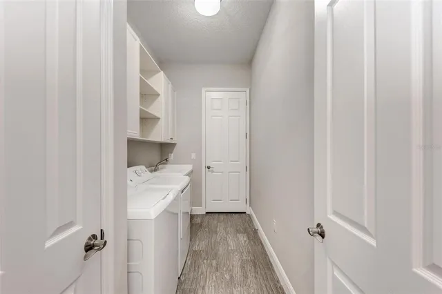 a view of a backyard with swimming pool