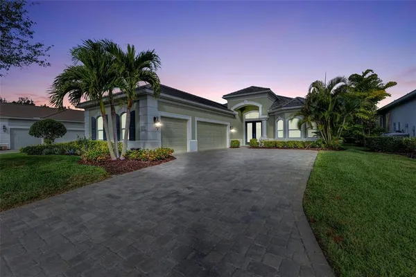 a front view of a house with a yard
