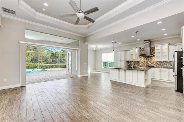 a view of kitchen with wooden floor and window