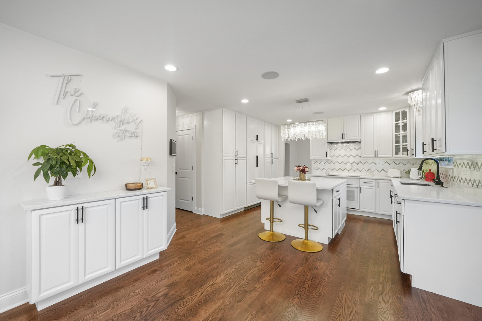 1916 Windstone Drive Plainfield, IL 60586 - Photo 16 of 50 a large white kitchen with white cabinets and stainless steel appliances