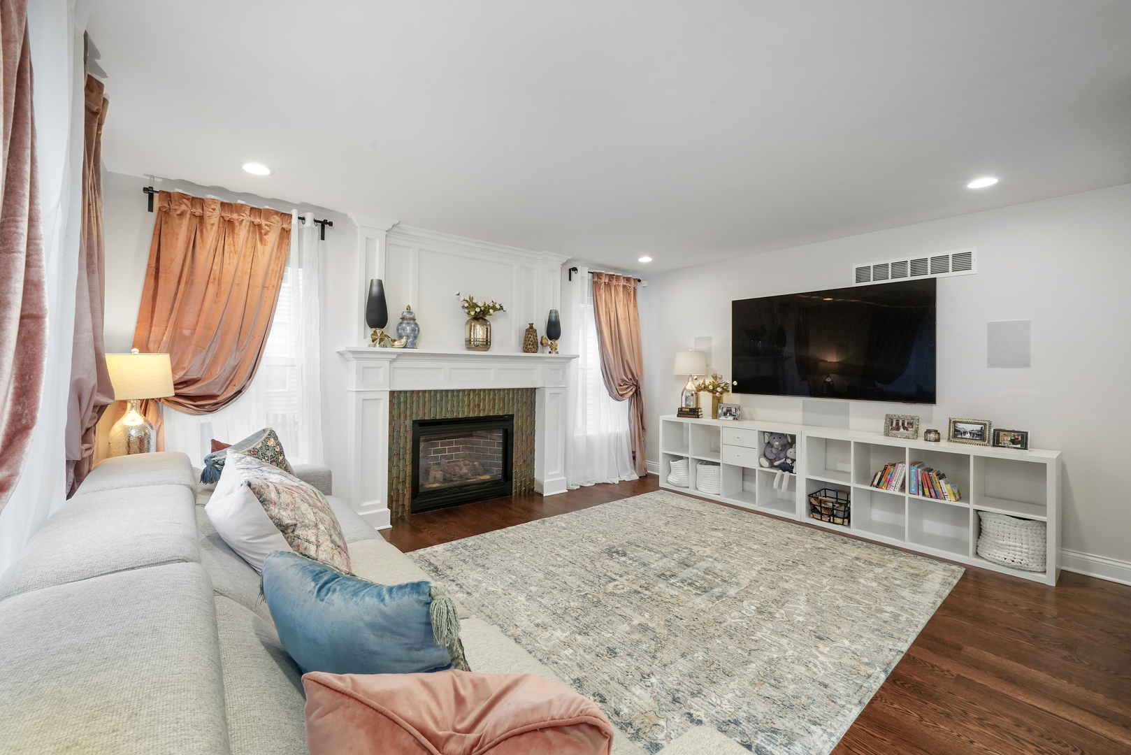 1916 Windstone Drive Plainfield, IL 60586 - Photo 22 of 50 a living room with furniture and a flat screen tv