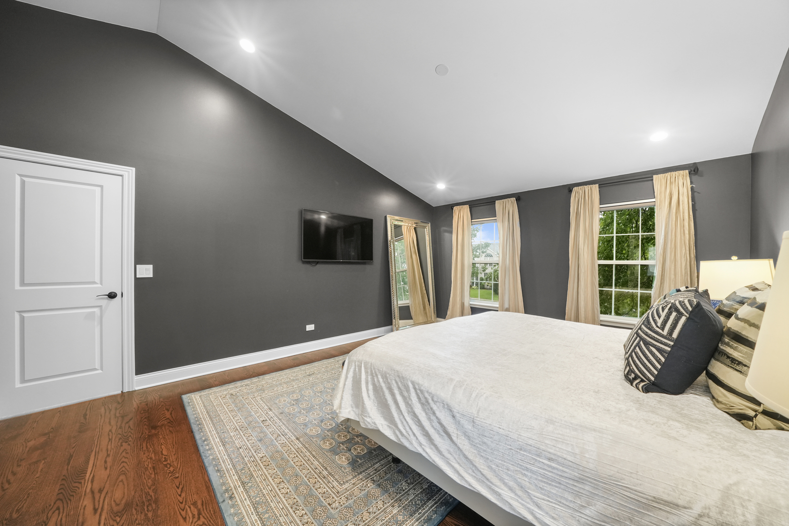 1916 Windstone Drive Plainfield, IL 60586 - Photo 29 of 50 a bedroom with a large bed and a flat tv screen