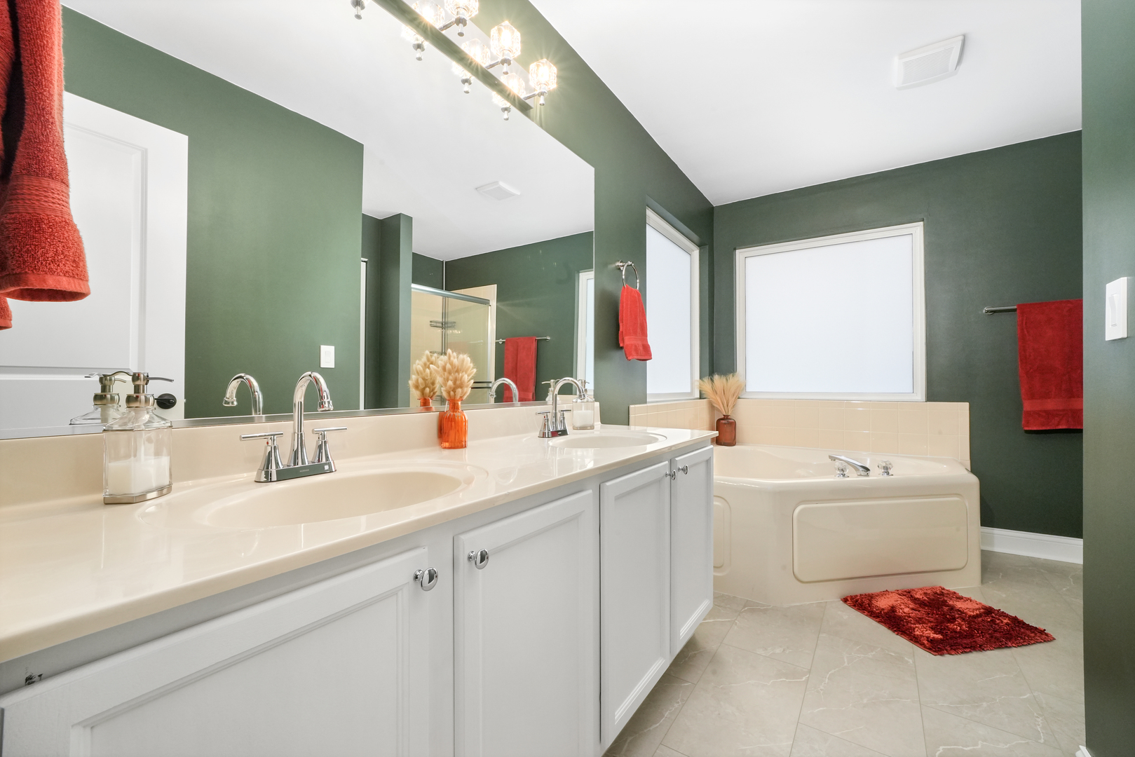 1916 Windstone Drive Plainfield, IL 60586 - Photo 32 of 50 a bathroom with a bathtub sink and mirror