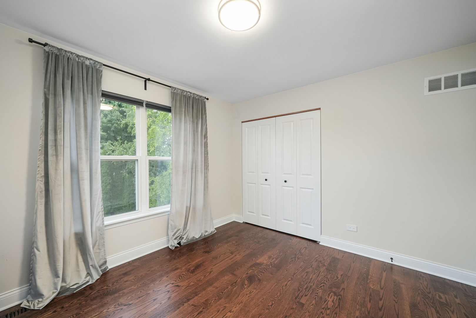 1916 Windstone Drive Plainfield, IL 60586 - Photo 33 of 50 a view of an empty room with wooden floor and a window