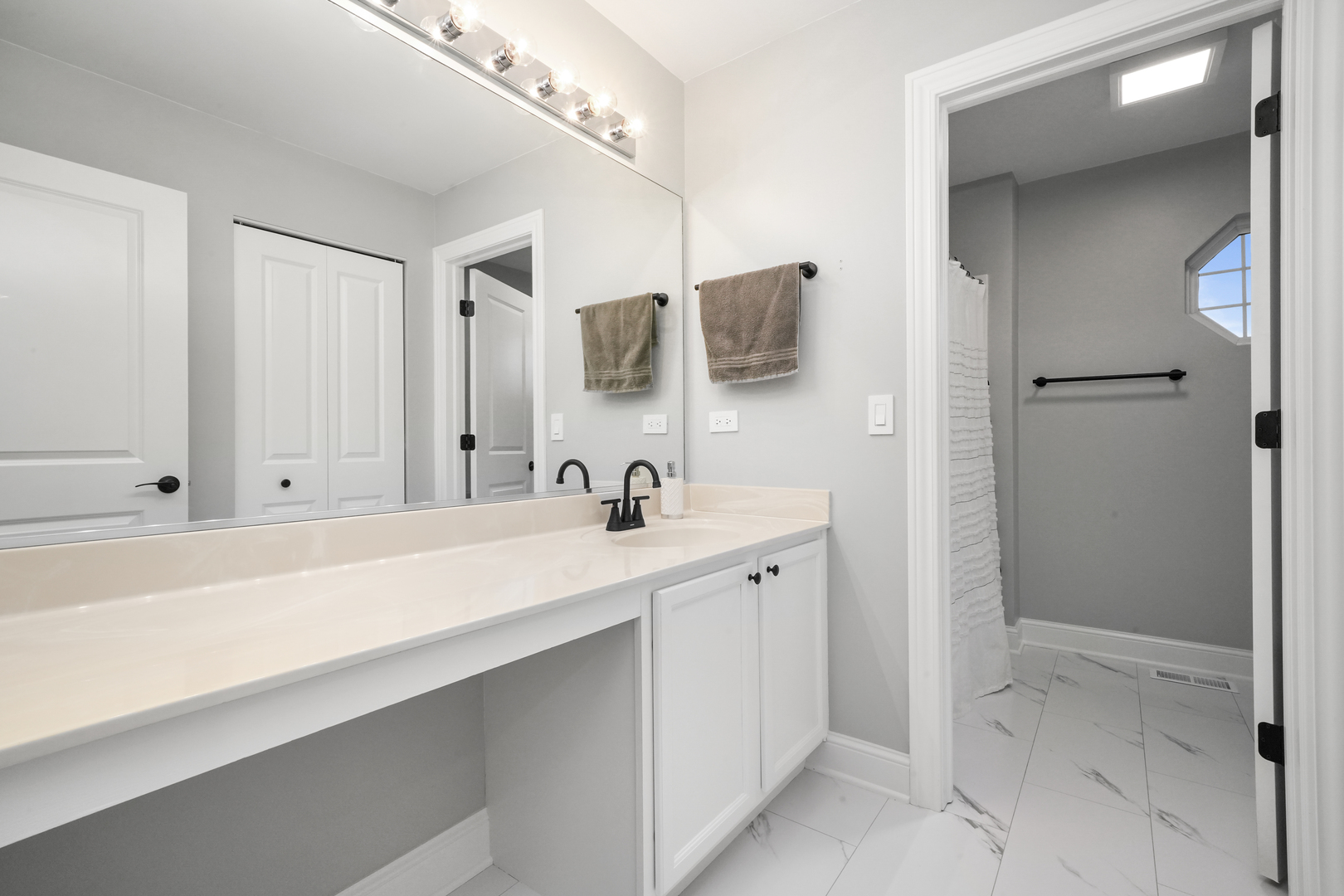 1916 Windstone Drive Plainfield, IL 60586 - Photo 34 of 50 a bathroom with a sink and a mirror