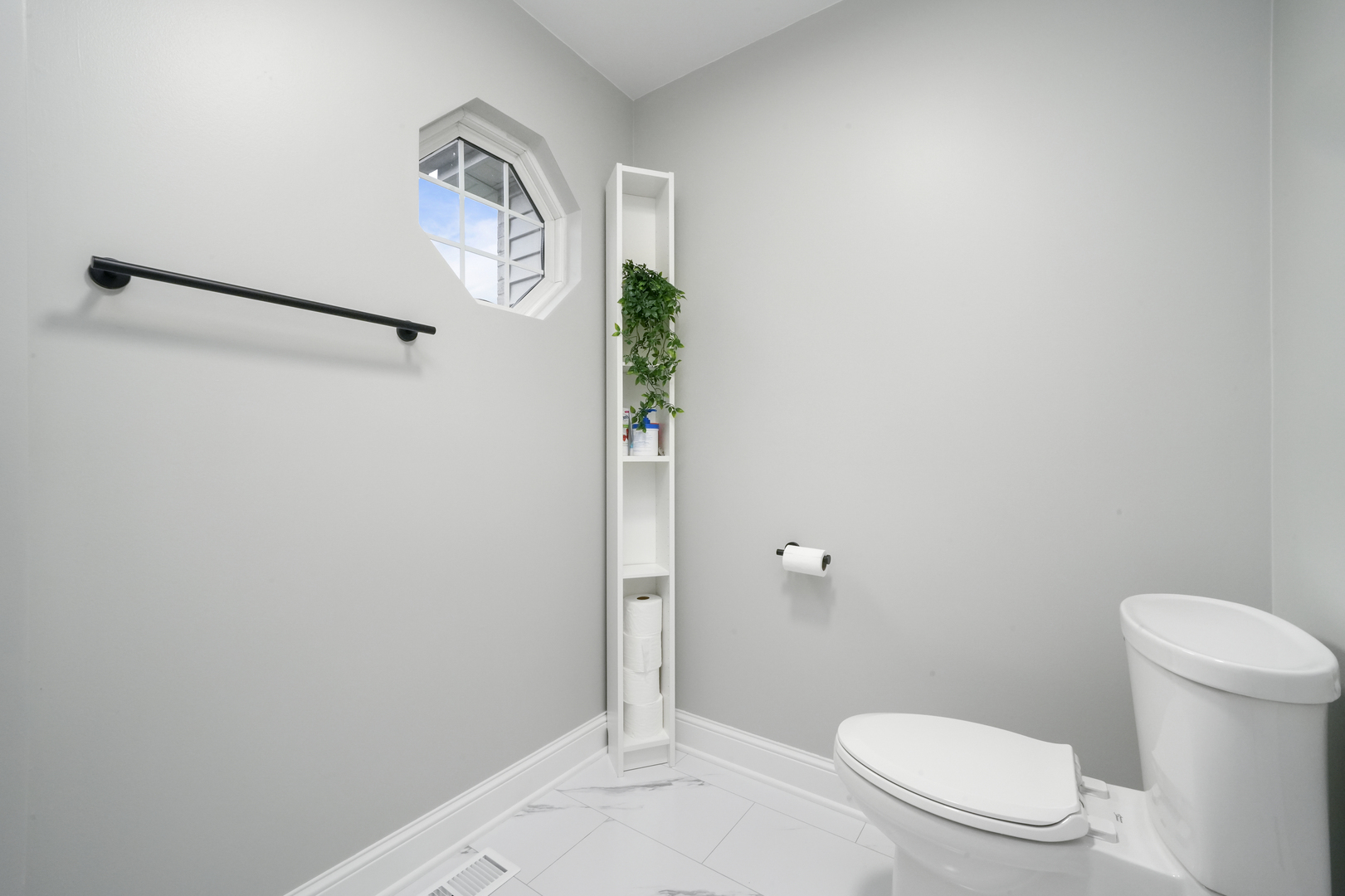 1916 Windstone Drive Plainfield, IL 60586 - Photo 35 of 50 a white toilet sitting next to a bathroom sink