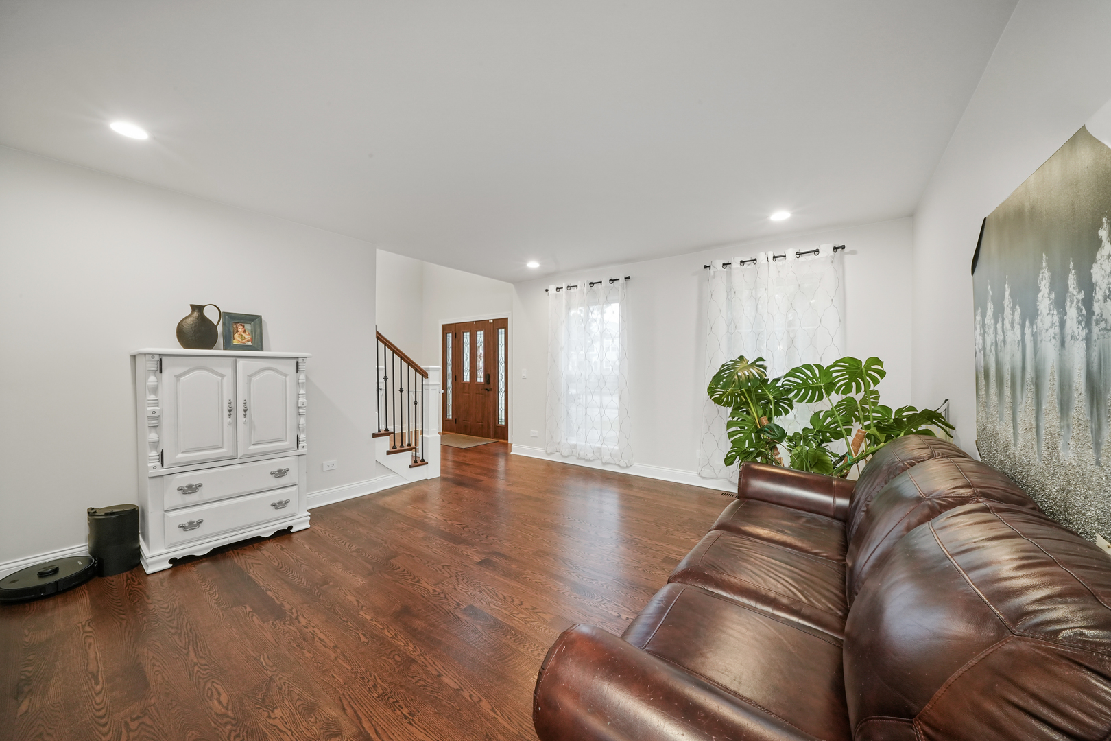 1916 Windstone Drive Plainfield, IL 60586 - Photo 9 of 50 a living room with furniture and wooden floor