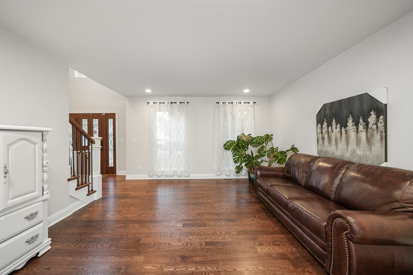 1916 Windstone Drive Plainfield, IL 60586 - Photo 10 of 50 a living room with furniture and wooden floor