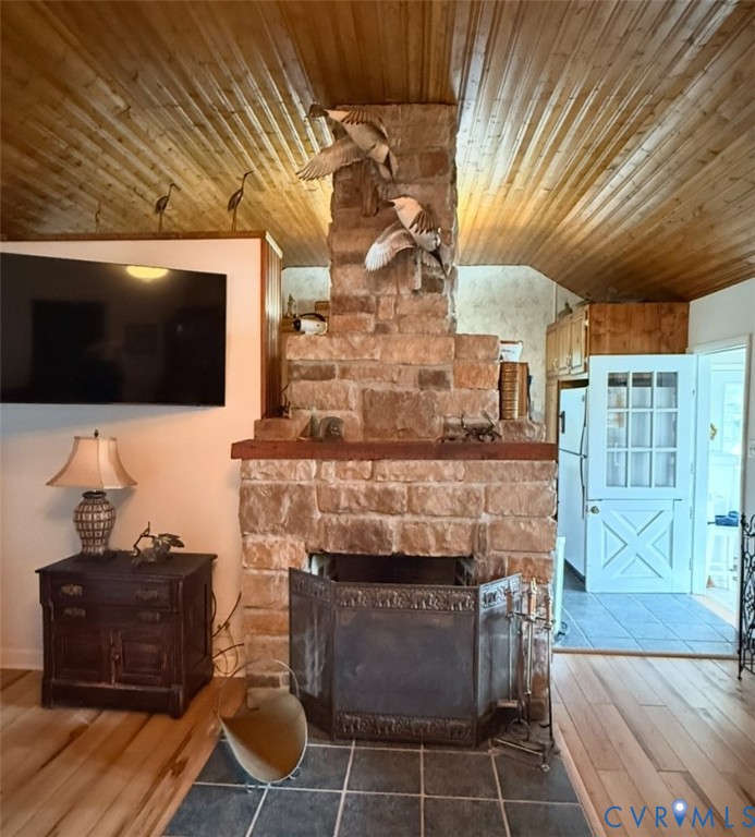 1686 Locust Grove Road Topping, VA 23169 - Photo 11 of 31 Living area with wood finished floors, wooden ceil