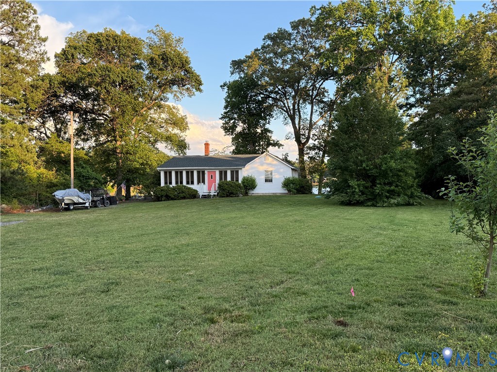 1686 Locust Grove Road Topping, VA 23169 - Photo 13 of 31 View of front of home with a front yard, a chimney