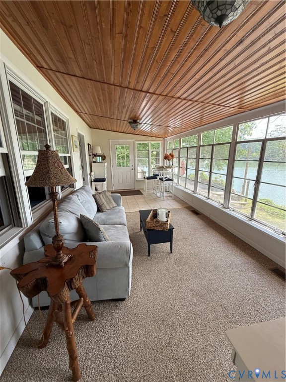 1686 Locust Grove Road Topping, VA 23169 - Photo 17 of 31 Sunroom featuring wooden ceiling, carpet floors, a