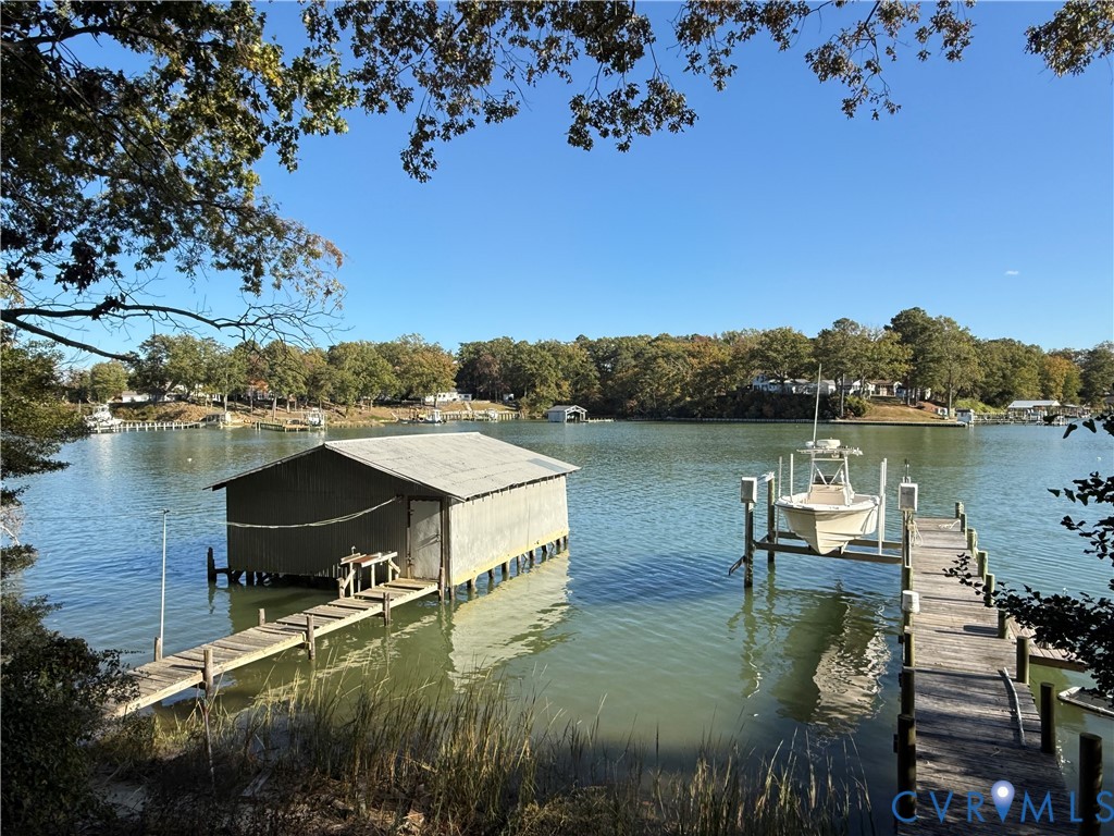 1686 Locust Grove Road Topping, VA 23169 - Photo 3 of 31 Dock area with boat lift and a water view