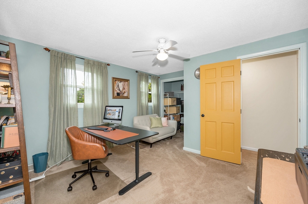 43 Constitution Way, Unit 43 Methuen, MA 01844 - Photo 21 of 25 a living room with furniture and a table