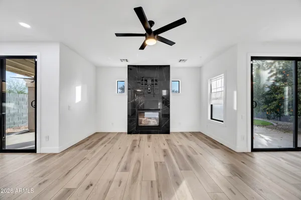 wooden floor in an empty room with a window