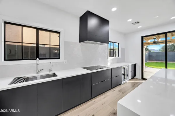 a large bathroom with a large tub and sink