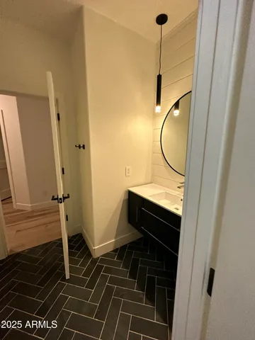 a bathroom with a mirror and a shower