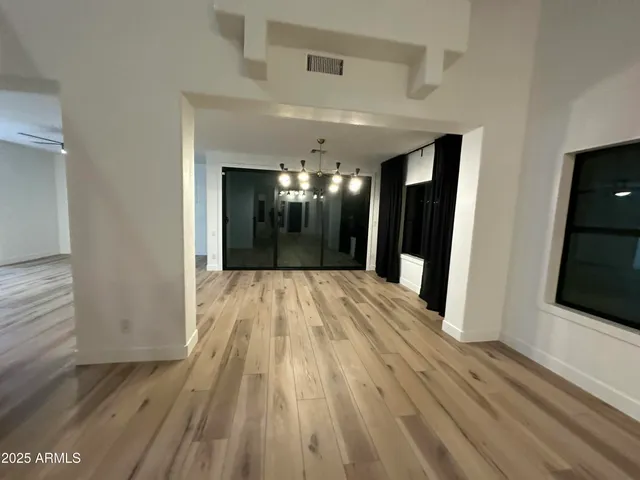 a view of gallery with wooden floor