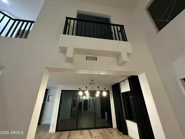 a view of a livingroom with furniture and staircase