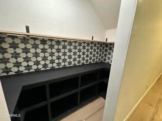 a bathroom with a bathtub and a double vanity sink