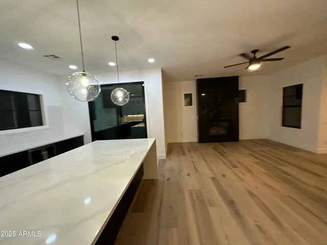 a kitchen with a sink and a refrigerator