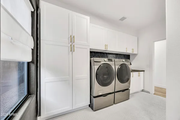 a utility room with dryer and washer