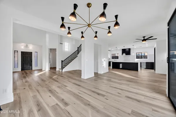 a view of a room with wooden floor and staircase