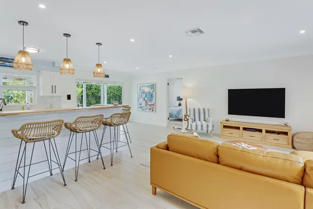 a bedroom with a bed and a night stand