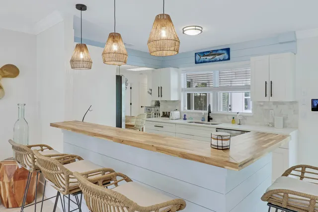 a bathroom with a granite countertop shower and a toilet
