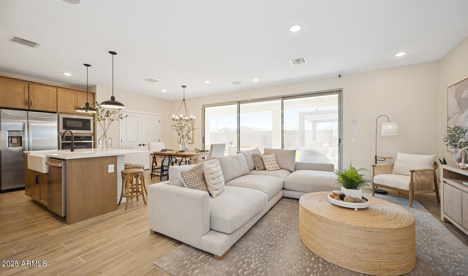 8026 West Royal Palm Road Peoria, AZ 85345 - Photo 11 of 37 a living room with furniture kitchen and a large window