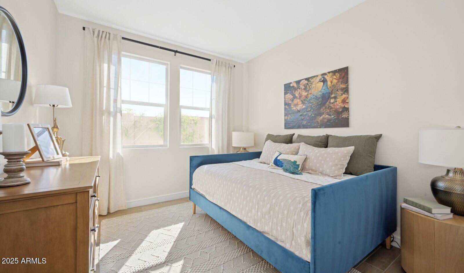 8026 West Royal Palm Road Peoria, AZ 85345 - Photo 14 of 37 a bedroom with bed and a window