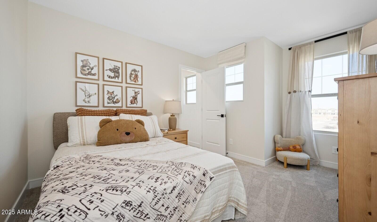 8026 West Royal Palm Road Peoria, AZ 85345 - Photo 21 of 37 a bedroom with a bed and a window