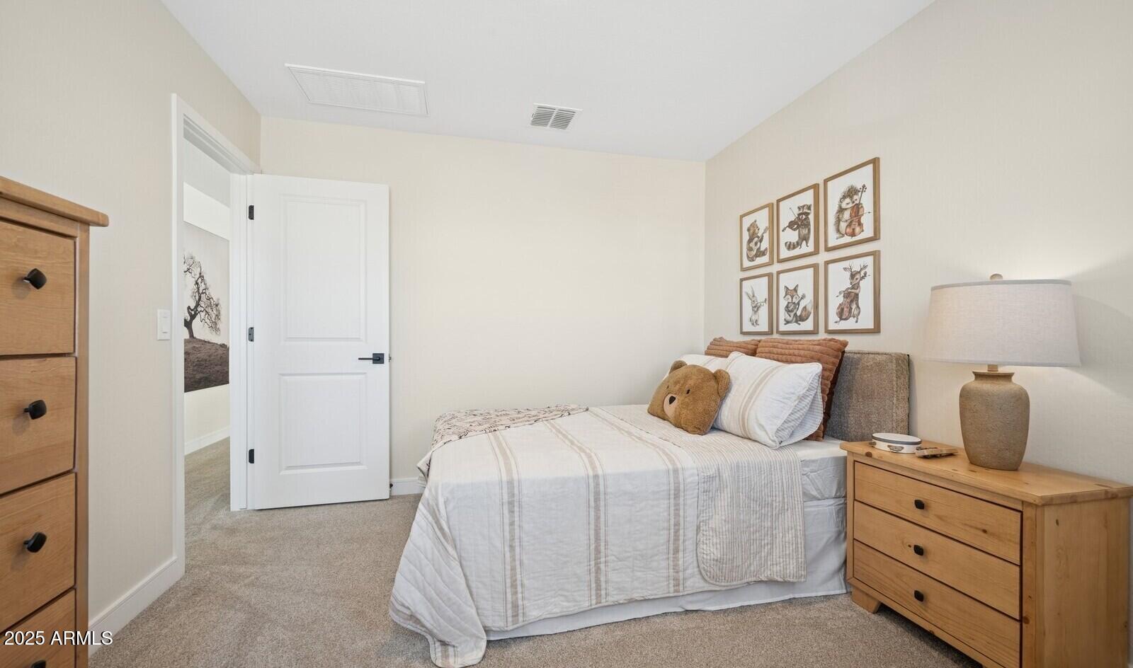 8026 West Royal Palm Road Peoria, AZ 85345 - Photo 22 of 37 a bedroom with a bed and a night stand