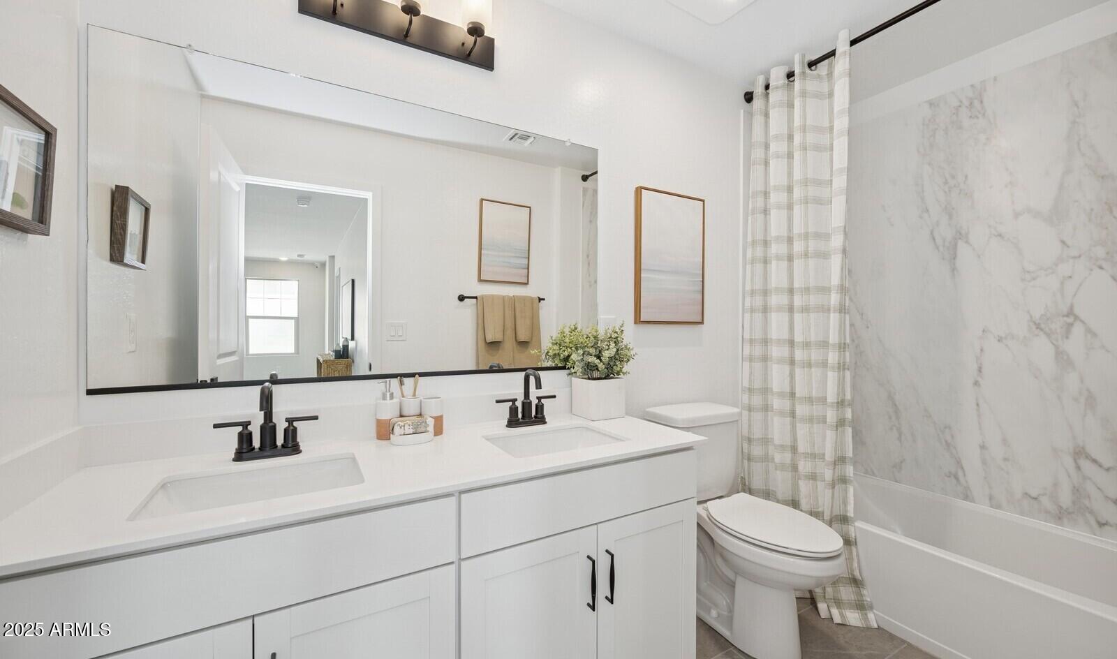 8026 West Royal Palm Road Peoria, AZ 85345 - Photo 23 of 37 a bathroom with a sink a toilet and shower