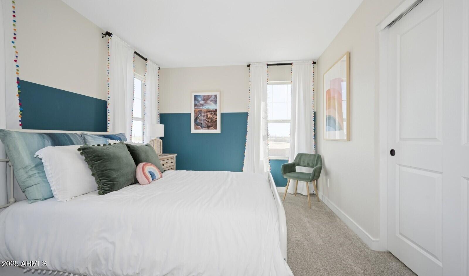 8026 West Royal Palm Road Peoria, AZ 85345 - Photo 27 of 37 a bedroom with a large bed and a window