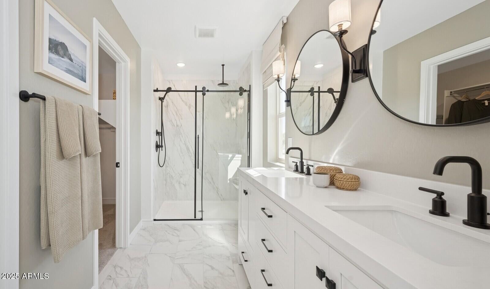 8026 West Royal Palm Road Peoria, AZ 85345 - Photo 31 of 37 a bathroom with a double vanity sink mirror and bathtub