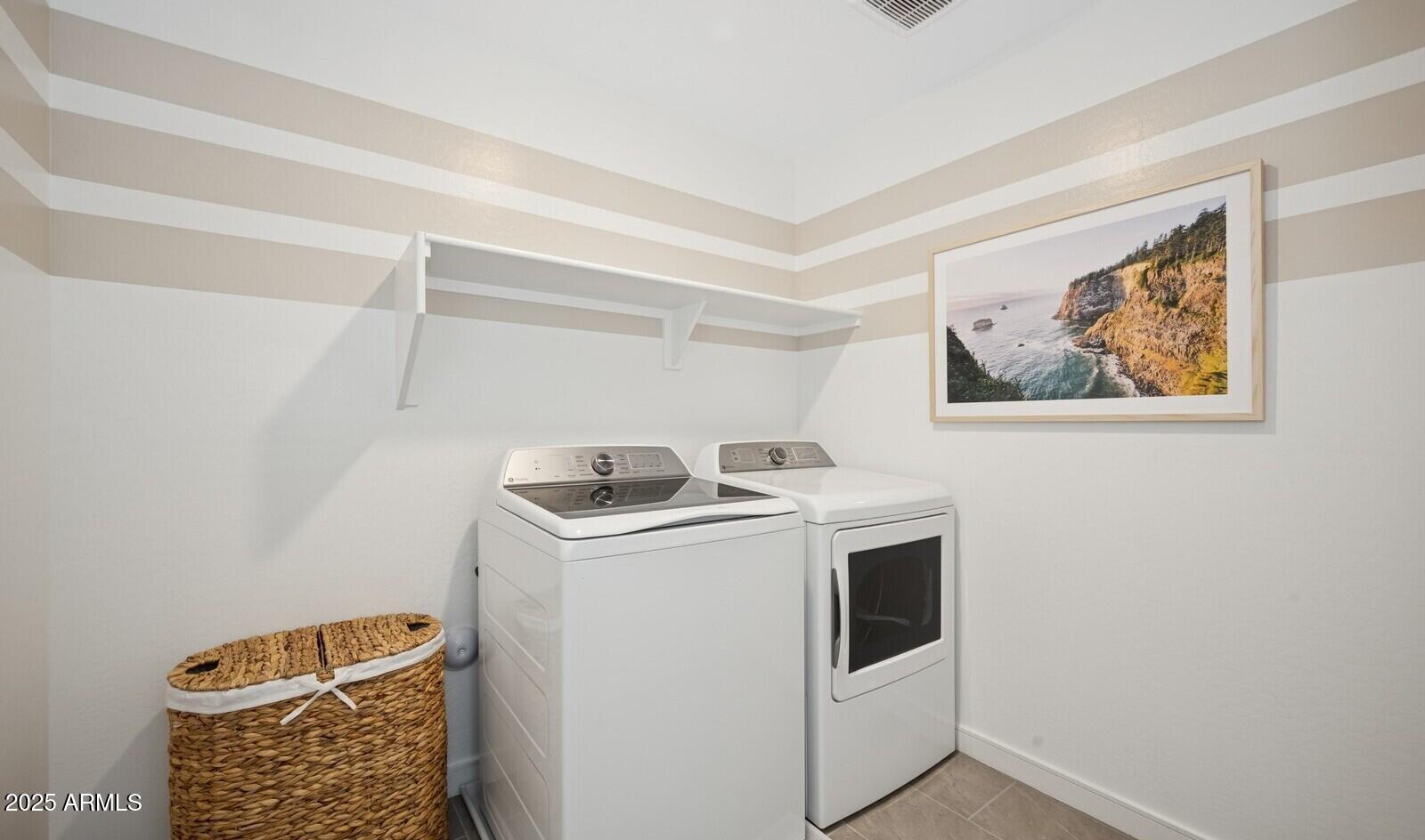 8026 West Royal Palm Road Peoria, AZ 85345 - Photo 34 of 37 a utility room with dryer and washer