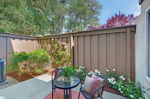 a backyard of a house with seating space