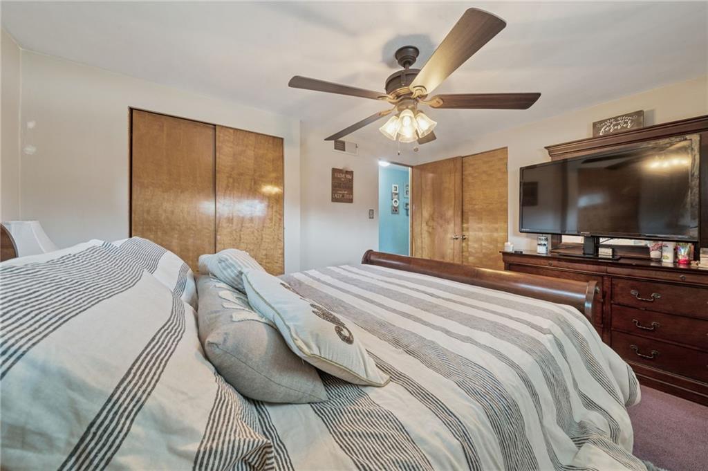 12629 Deborah Drive Irwin, PA 15642 - Photo 11 of 33 a bedroom with a bed and a flat screen tv