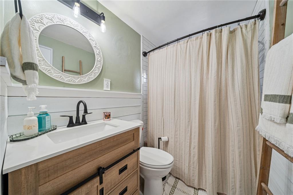 12629 Deborah Drive Irwin, PA 15642 - Photo 16 of 33 a bathroom with a sink a toilet and a mirror