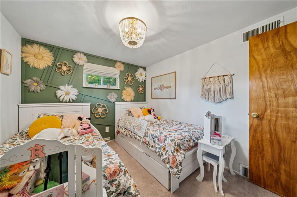 12629 Deborah Drive Irwin, PA 15642 - Photo 19 of 33 a bedroom with two beds and a large window