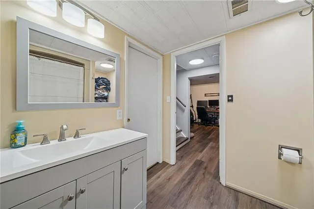 a en suite bathroom with a sink a mirror and a shower