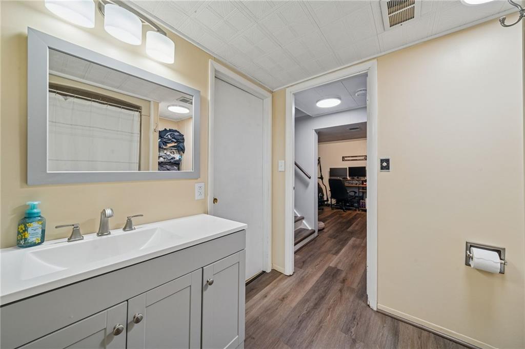 12629 Deborah Drive Irwin, PA 15642 - Photo 21 of 33 a en suite bathroom with a sink a mirror and a shower