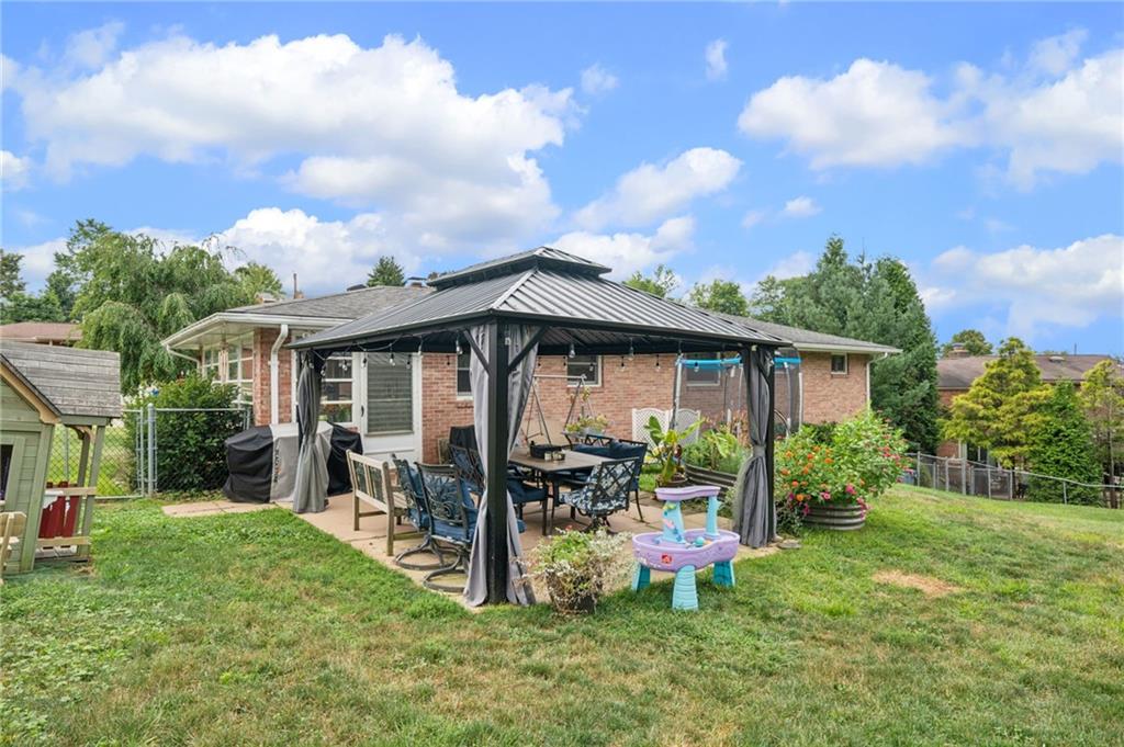 12629 Deborah Drive Irwin, PA 15642 - Photo 27 of 33 a view of a house with backyard sitting area and garden