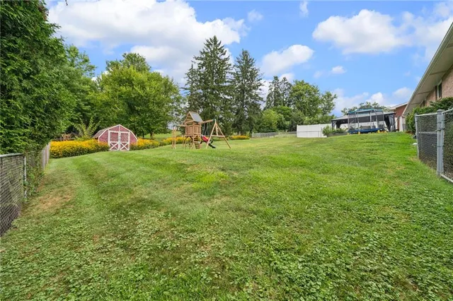 a view of a house with a back yard