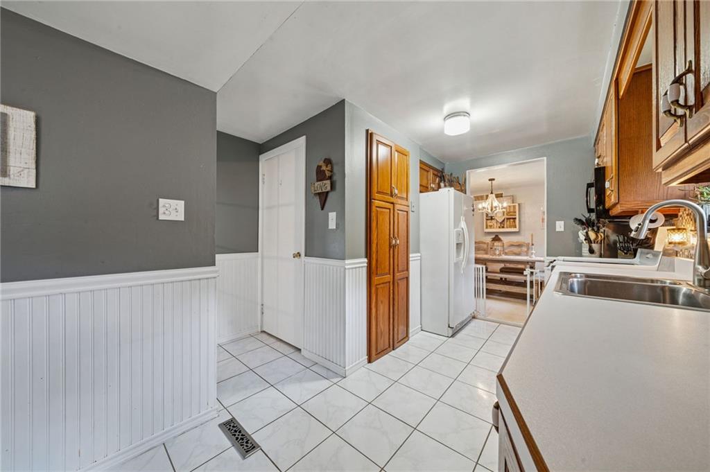 12629 Deborah Drive Irwin, PA 15642 - Photo 8 of 33 a kitchen with stainless steel appliances kitchen island granite countertop a refrigerator and a stove top oven